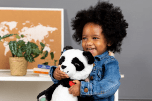 Little Girl Hugging Pause with Panda